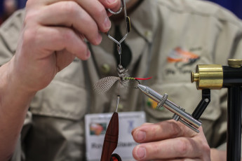 Royce Stearns tying a Grizzly King.