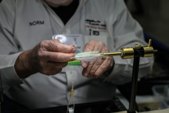 Norm demonstrating tube flies on a Nor-Vise.